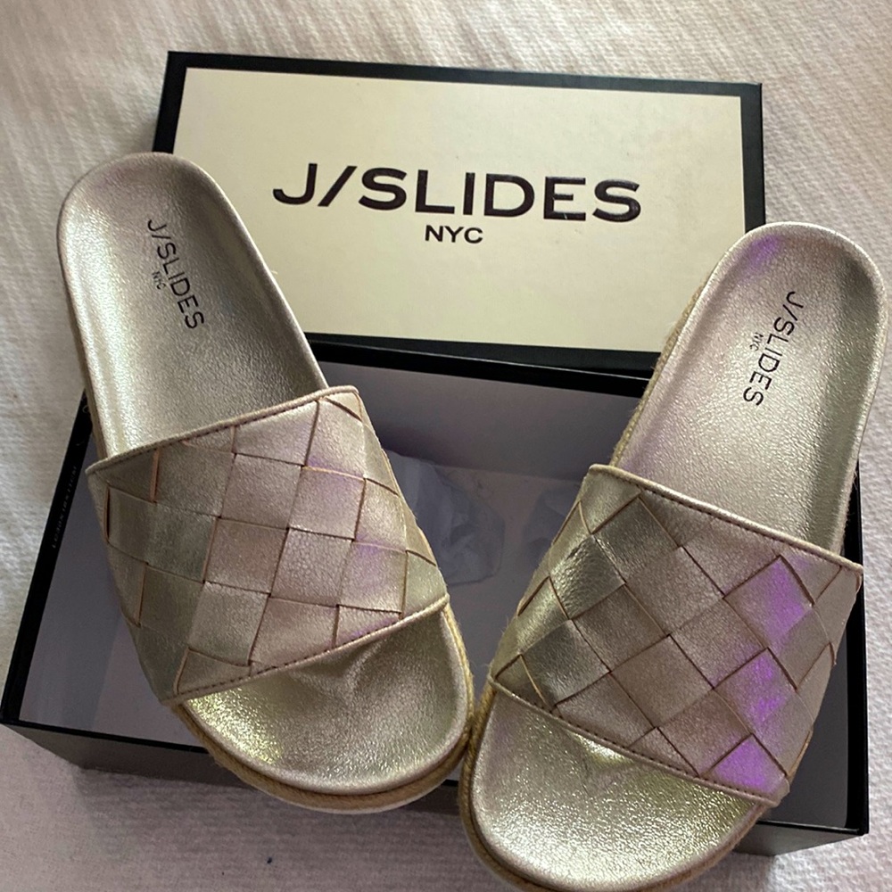 New in Box metallic leather slides.Color is a cross between silver and gold.